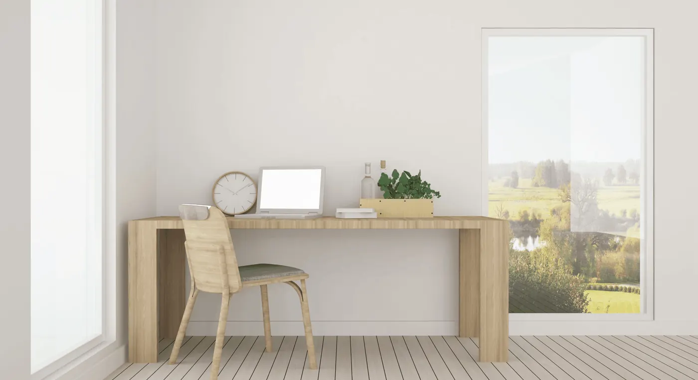 A tidy minimalist desk with a laptop beside a bright window: a site with nothing to untangle